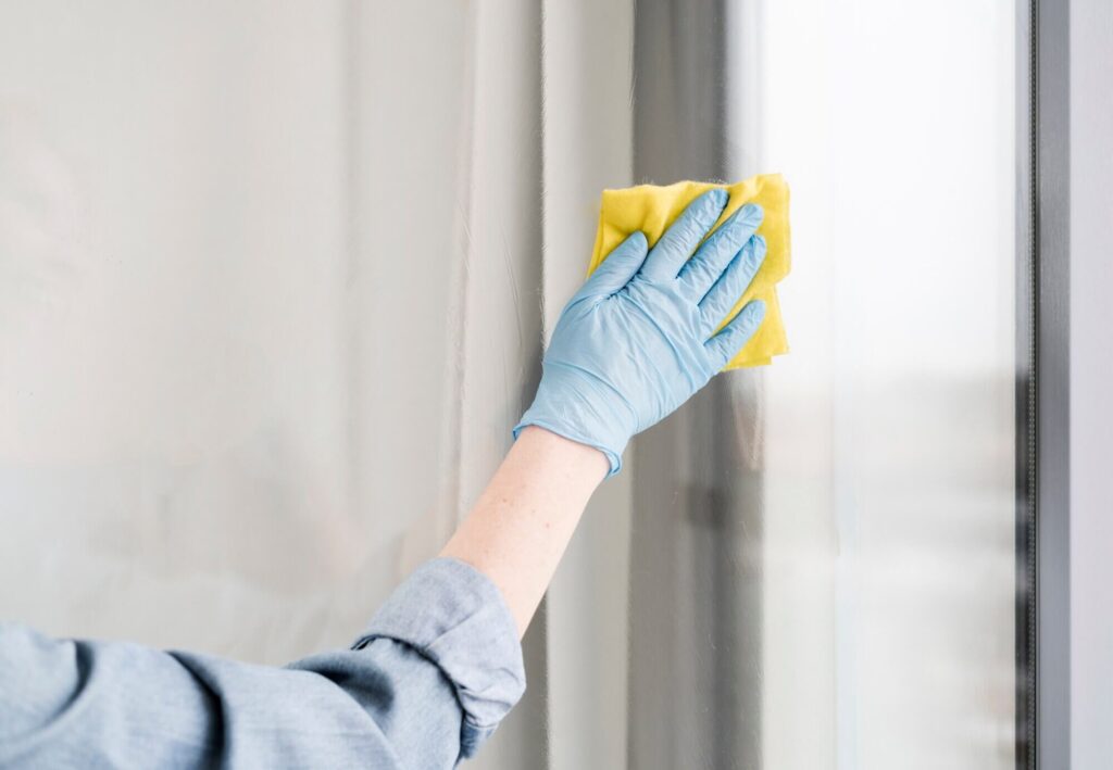 Using a soft cloth or clean synthetic sponge to wash window film to prevent water spots and streaks.